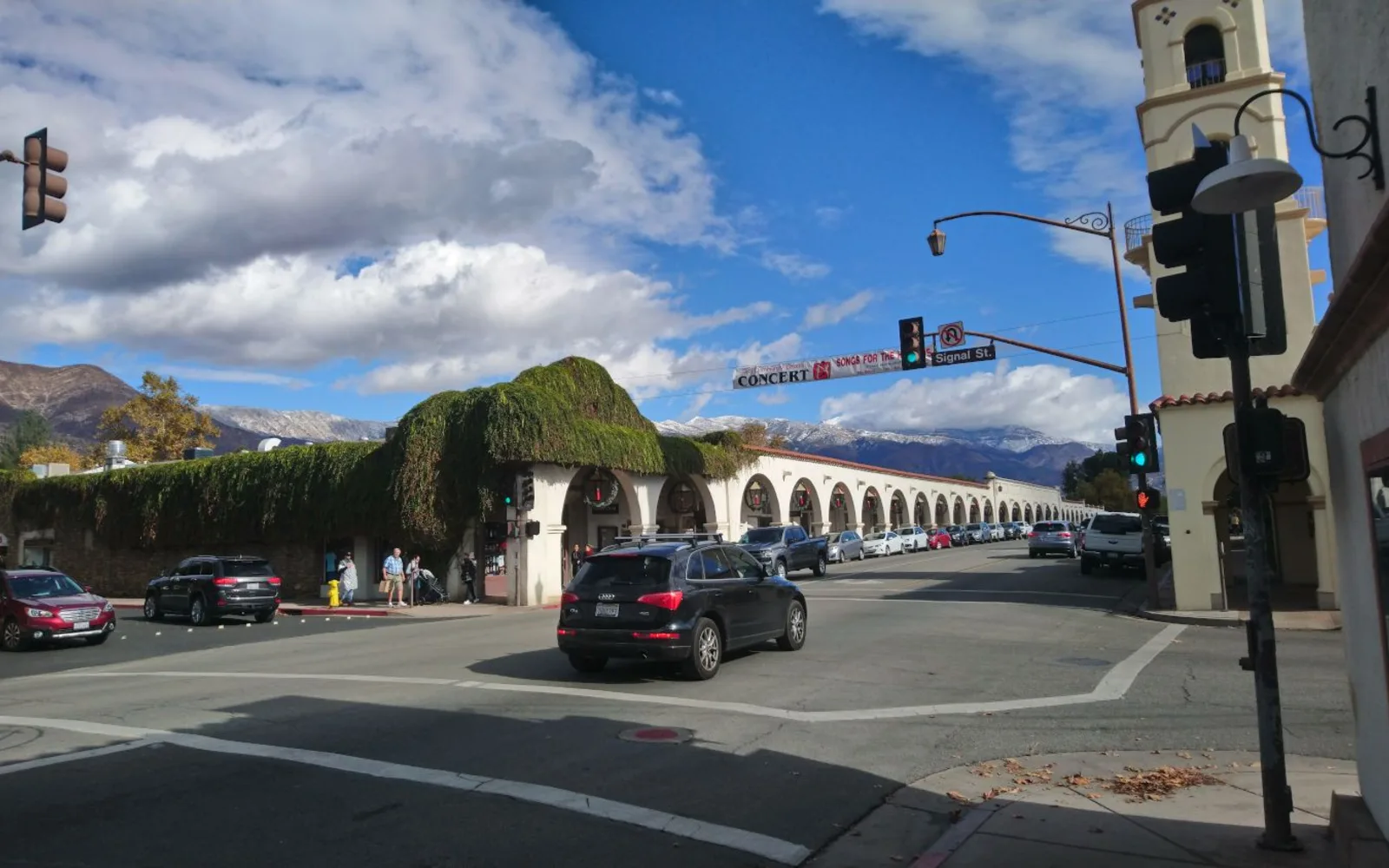 Historic downtown Ojai street with storefronts and the Topatopa mountains visible in the distance